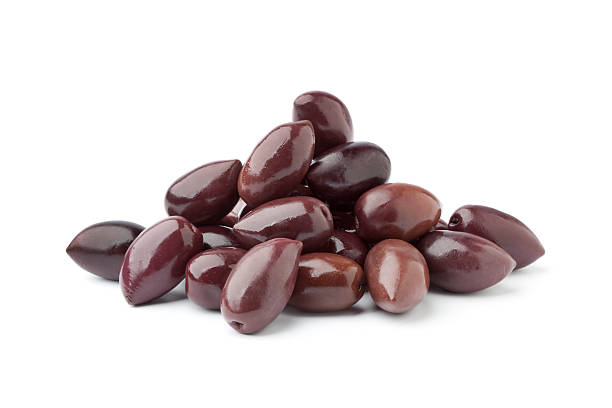 Heap of black Calamata olives on white background